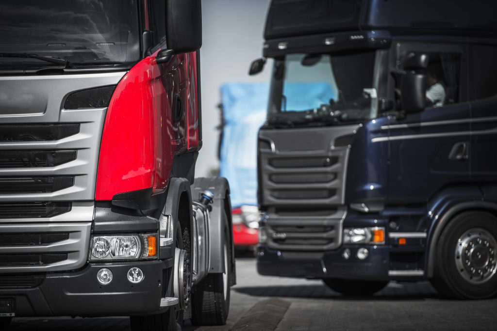 Euro Trucks Convoy Concept. Truck Driving and Transportation.