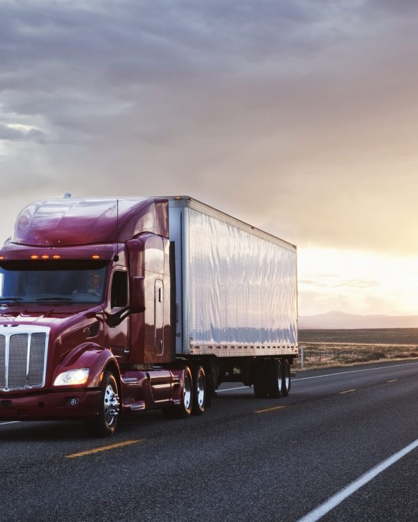 3/4 front view of a commercial truck on the road at sunset  in eastern Washington, USA